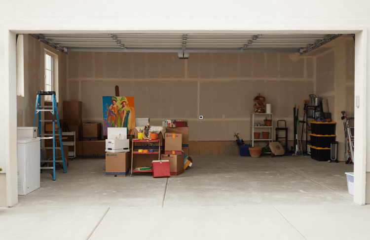 Garage storage space for rent with boxes and items inside