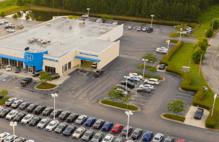 Parking lot with cars and open spaces for vehicle parking